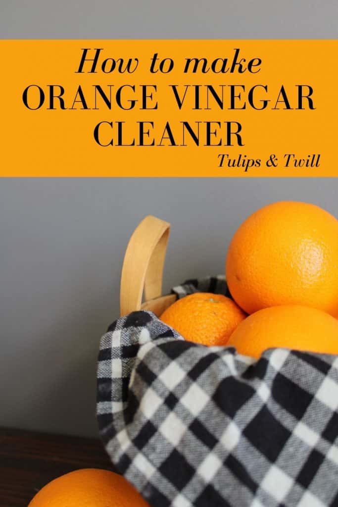 a pinnable graphic of oranges in a wooden basket with a black and white plaid tea towel