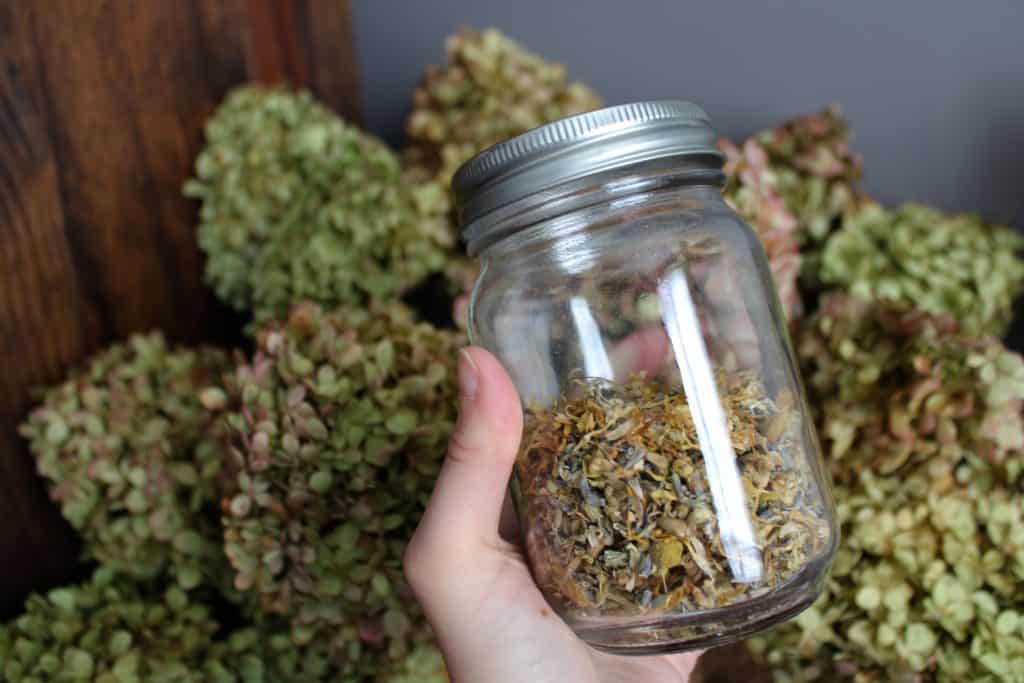 a close up of the herbs in a jar