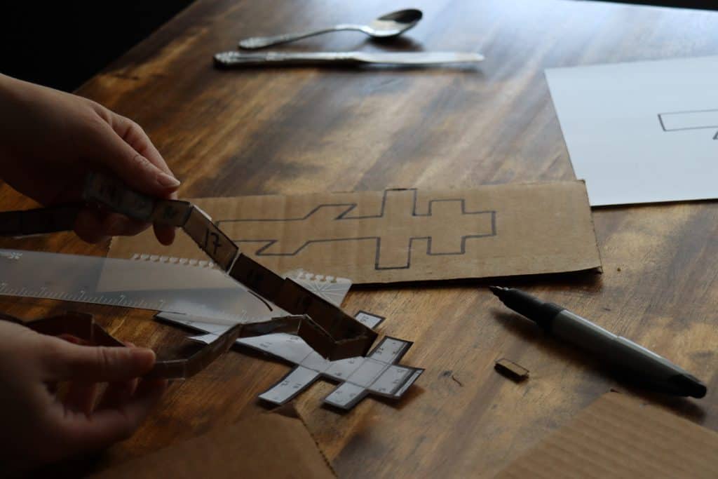 showing the numbered sides of the cardboard pieces