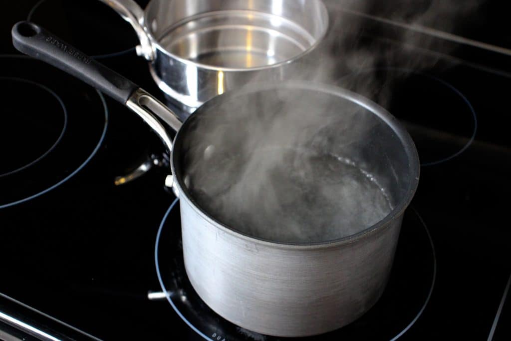 boiling water in the bottom of a double boiler
