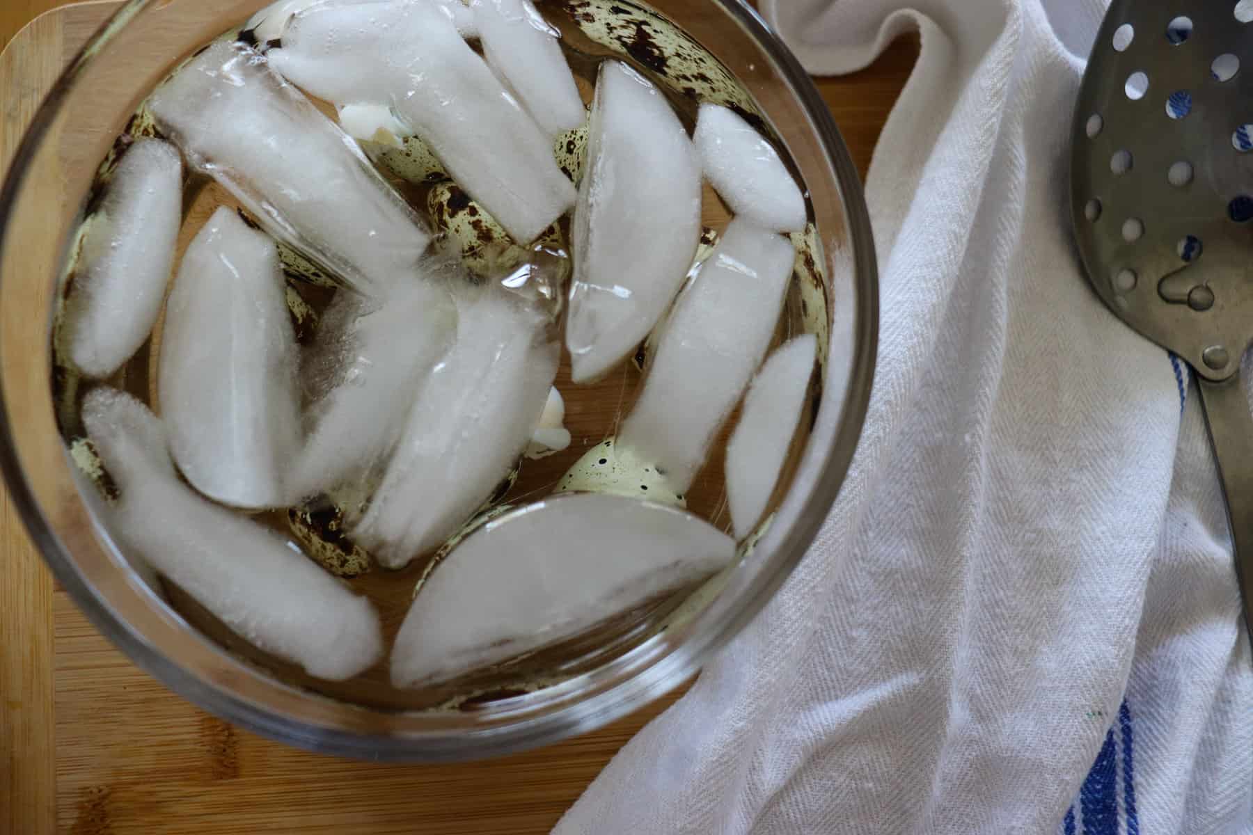 quail eggs in an ice bath