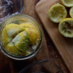 fermented lemons packed with salt in a jar