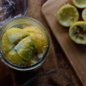 fermented lemons packed with salt in a jar