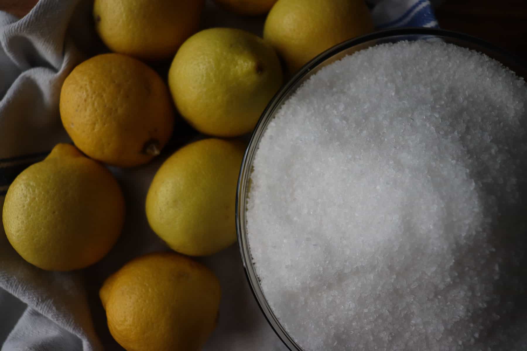 lemons next to a bowl of salt