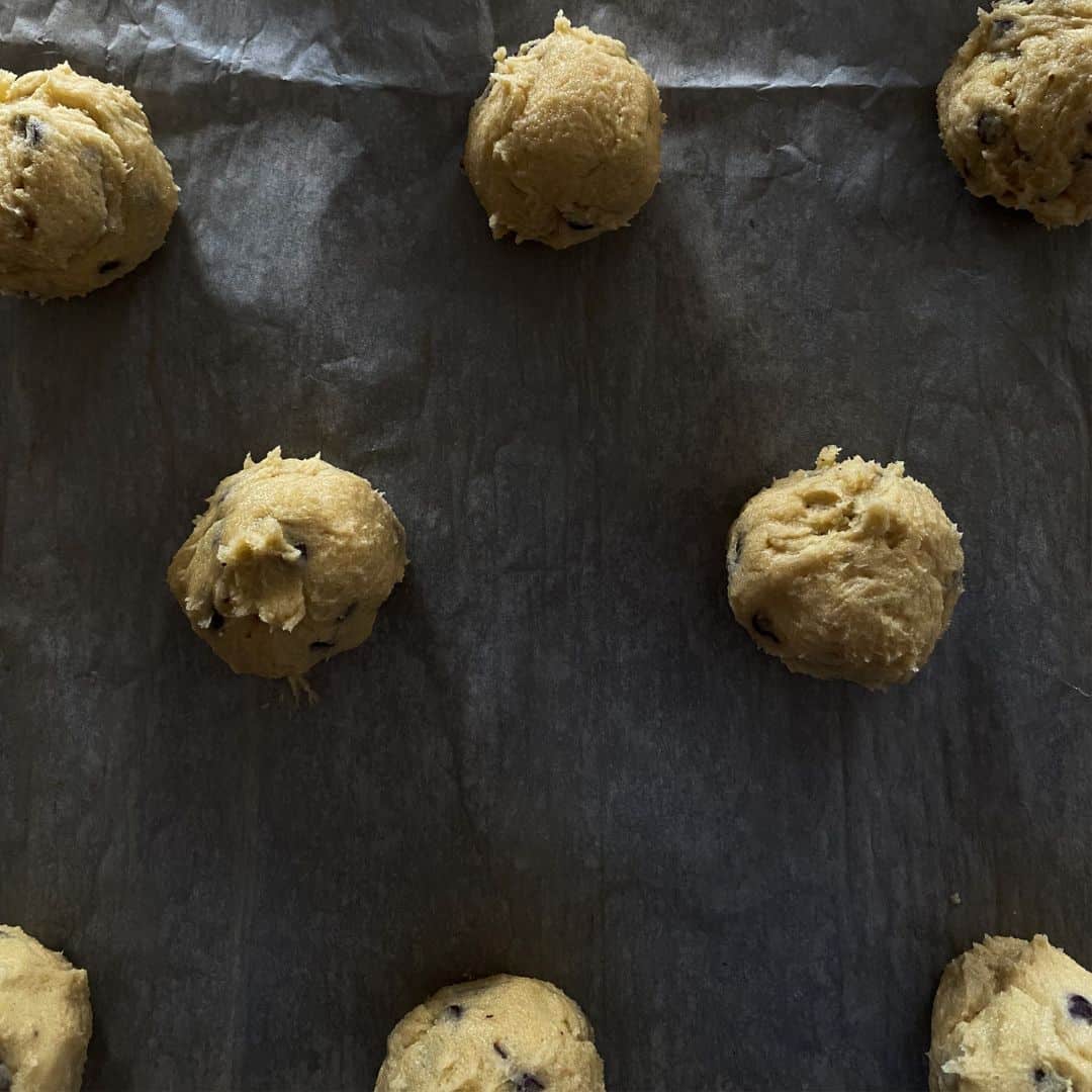 balls of cookie dough spaced out on a baking sheet