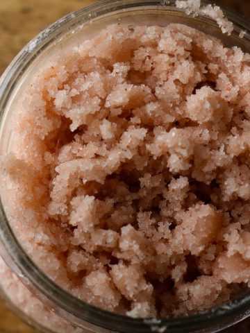 pink salt scrub in a glass jar