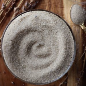 lavender sugar with dried lavender and a golden spoon