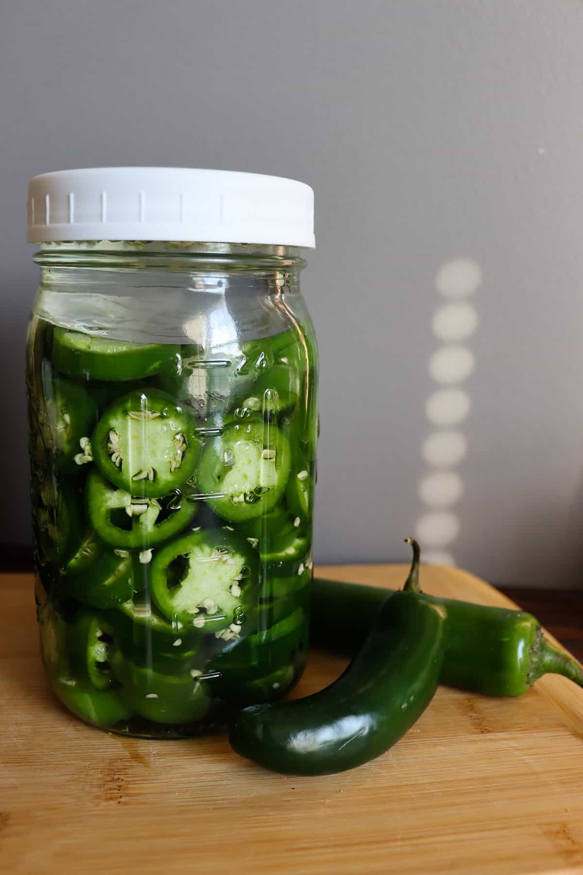 the jar is ready to ferment over time. it is next to whole jalapeños