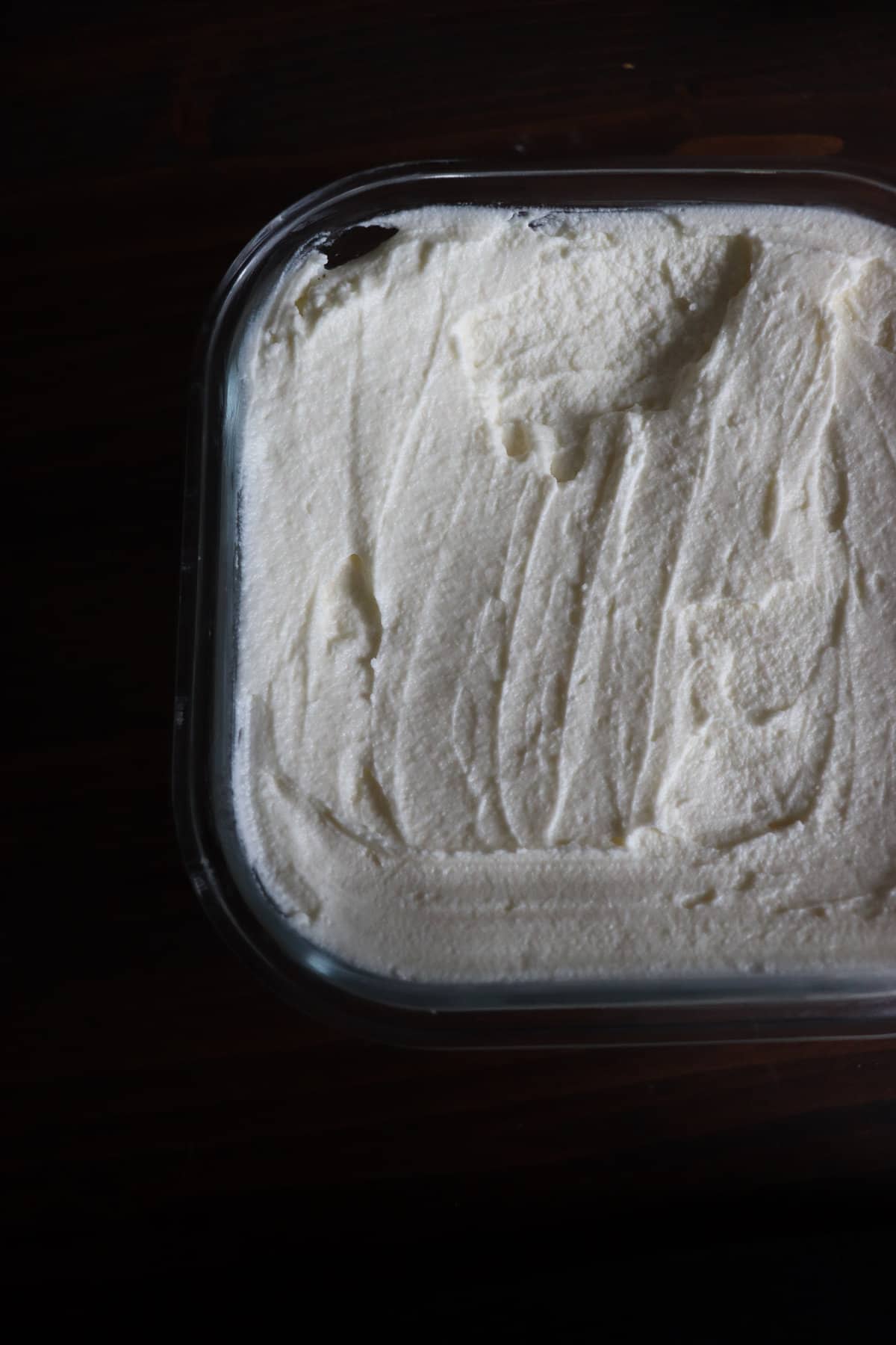 creamy homemade cream cheese in a glass container